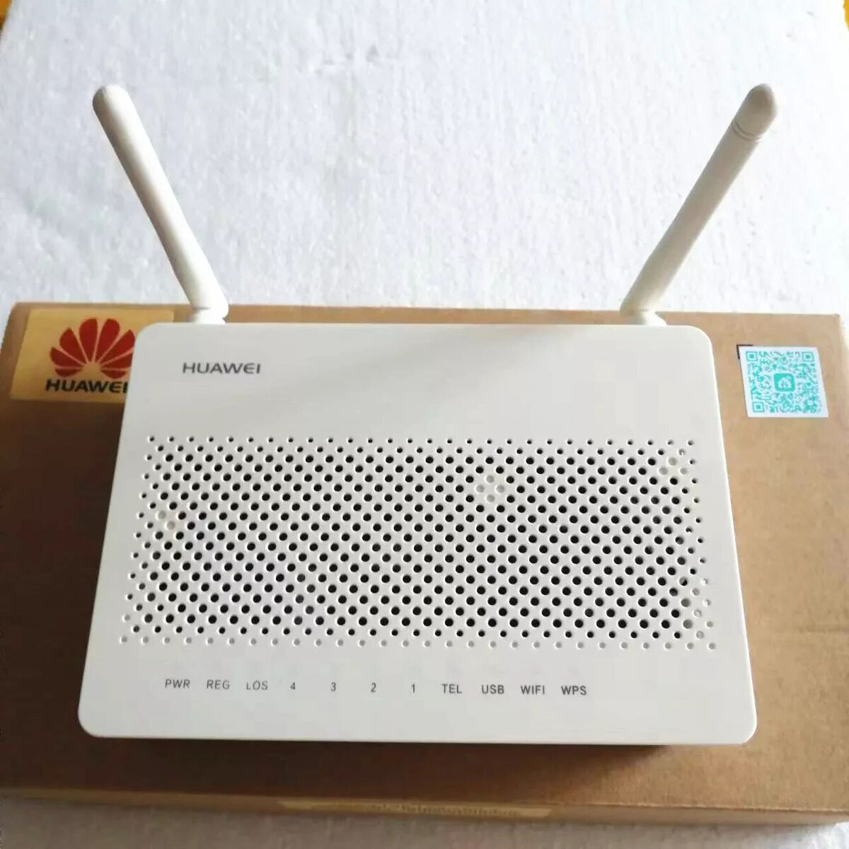 Huawei Dual Antenna GPON WiFi Router with Power Adapter – High-Speed Fiber Internet Modem 4 Front view of Huawei GPON WiFi Router with dual antennas, LAN and TEL ports – white color modem for FTTH connections